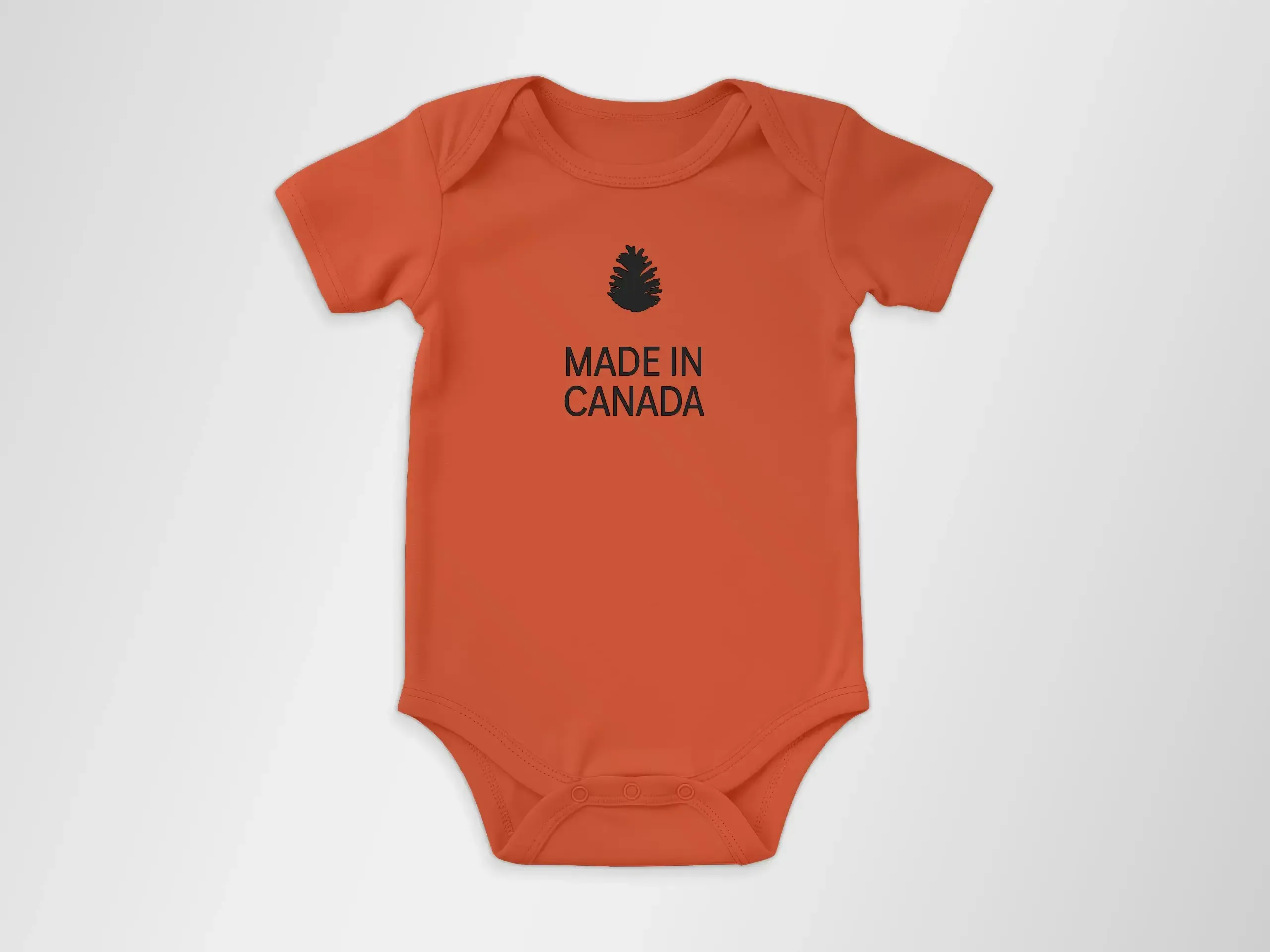 Orange babie onesie that has a pinecone and the words